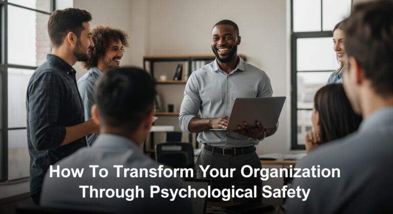 A man holding a laptop and speaking to his employees about psychological safety in the workplace